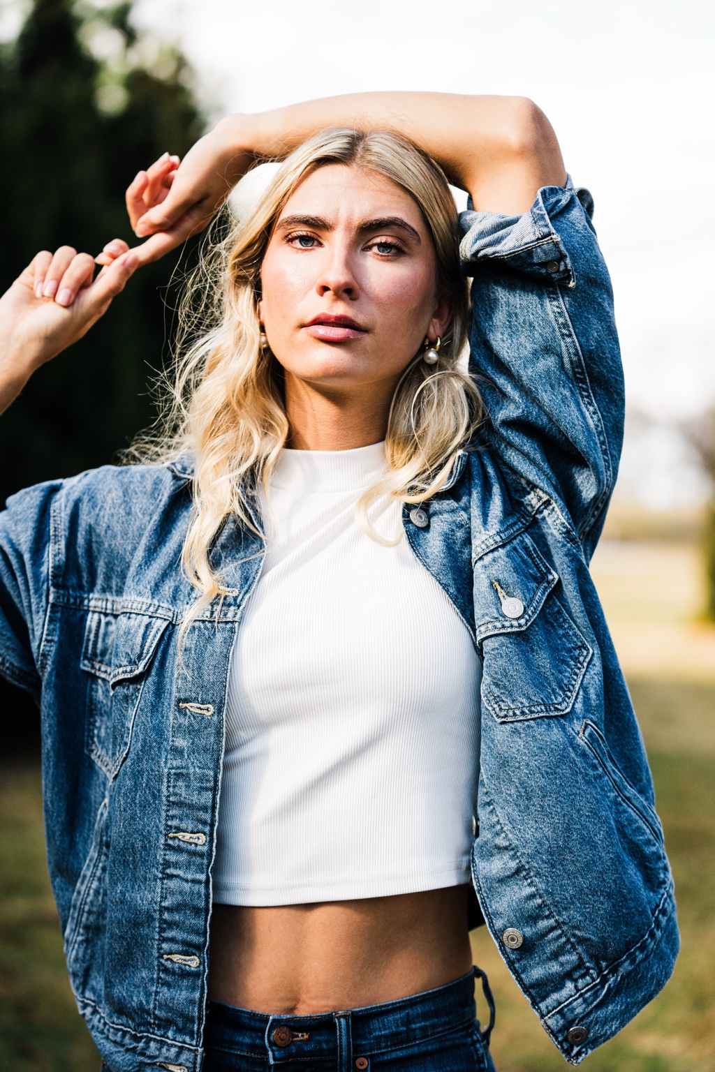Cecilia Pogue: outdoor portrait wearing a denim jacket